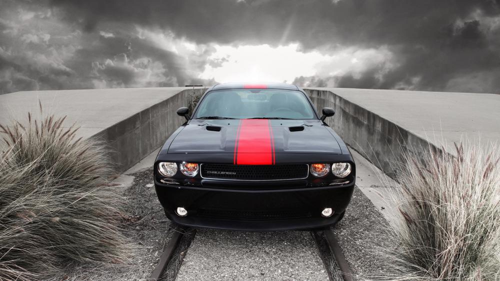 Dodge Challenger Muscle Car with Red Racing Stripe Under Stormy Skies wallpaper