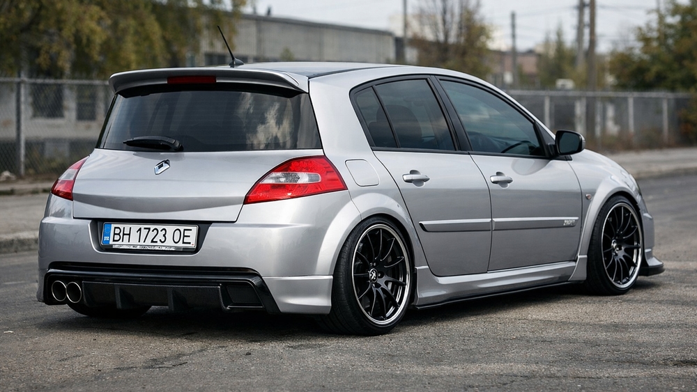 Sleek Silver Renault Hatchback Stance on Urban Asphalt wallpaper