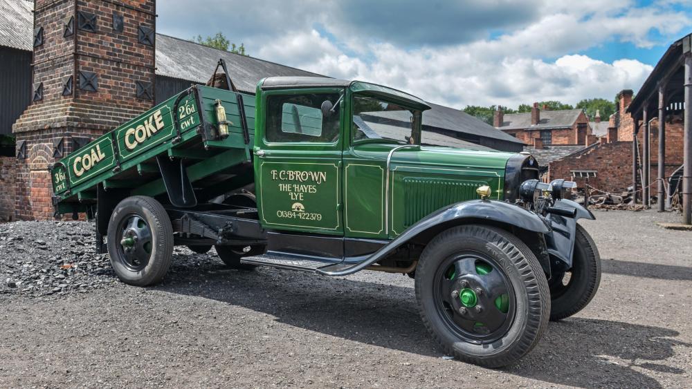 Vintage Ford Model AA Coal Truck in Industrial Yard 4K Wallpaper wallpaper