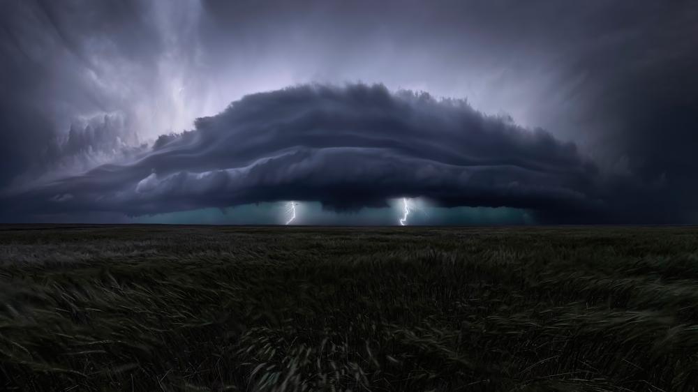 Massive Shelf Cloud Unleashing Lightning Over Prairie at Dusk wallpaper