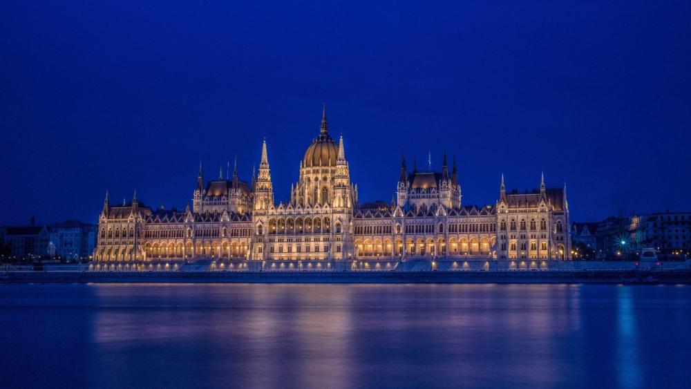 Budapest Parliament Glowing Over the Danube at Blue Hour wallpaper