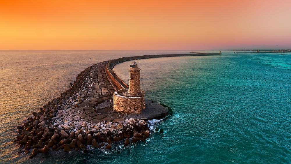 Faro Livorno Lighthouse at Dusk on the Curving Sea Breakwater wallpaper