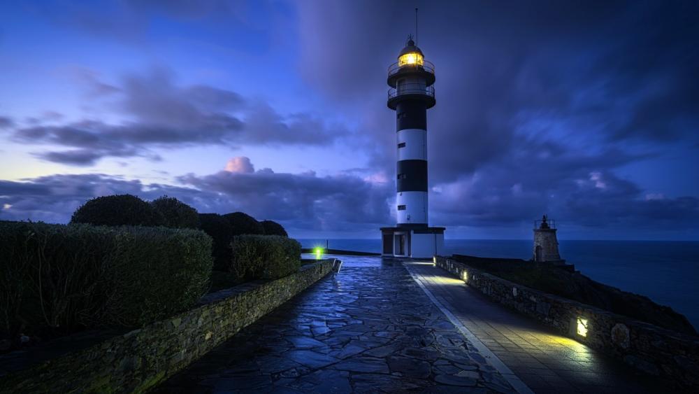 Twilight Beacon at Faro de Cabo San Agustín Asturias Coast Spain wallpaper
