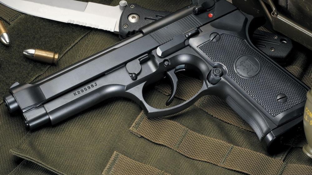 Beretta M9 Tactical Sidearm Closeup on Field Gear wallpaper