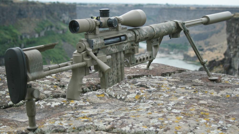 Camouflaged Precision Rifle on Rocky Overlook in Ultra HD wallpaper