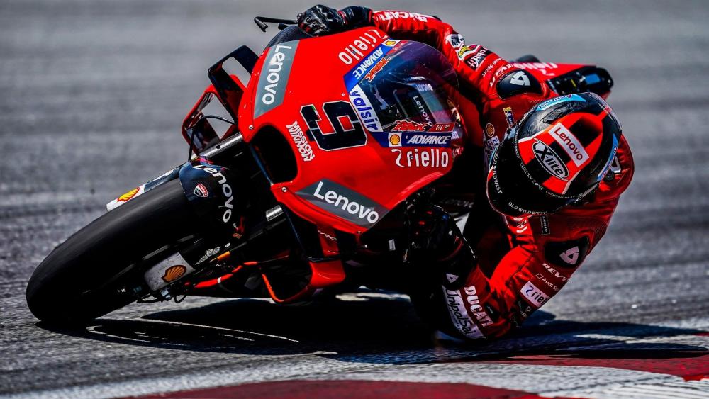 Ducati MotoGP Rider Carving a Perfect Apex at Full Lean wallpaper