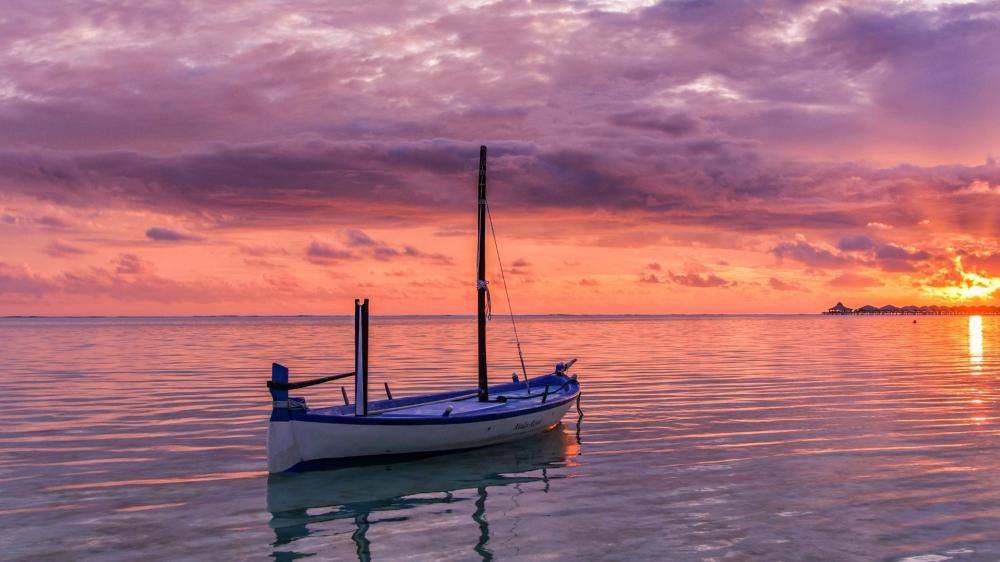 Silent Boat at Blazing Sunset Horizon Over Glassy Sea wallpaper