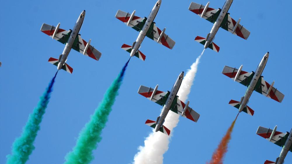 Tricolor Aerobatic Jets in Precision Formation Over Clear Blue Sky wallpaper