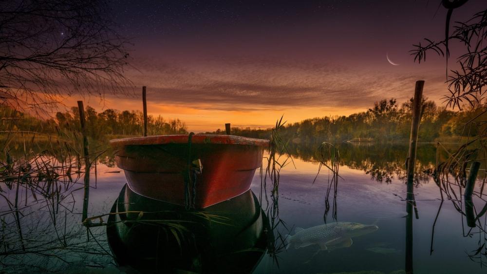 Afterglow Drift Boat at Dusk on a Quiet Lake wallpaper