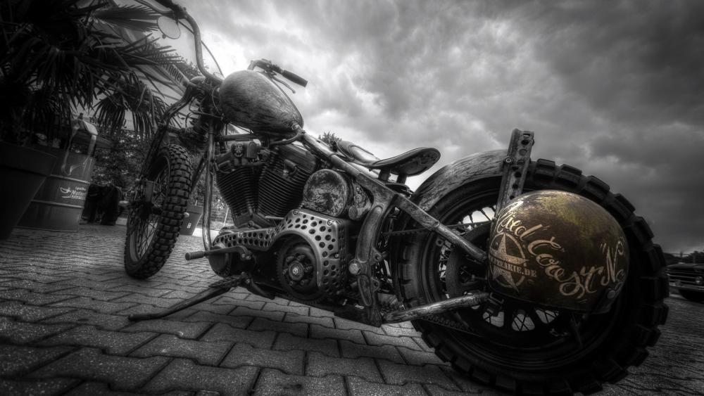 Gritty Monochrome Custom Motorcycle Under Stormy Skies wallpaper