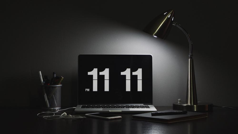 Monochrome Laptop Desk Setup with 11 11 Flip Clock Glow wallpaper