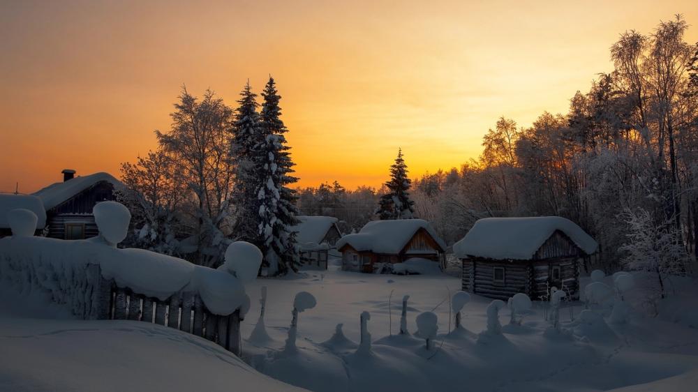 Golden Dawn Over a Quiet Snowy Village Retreat wallpaper