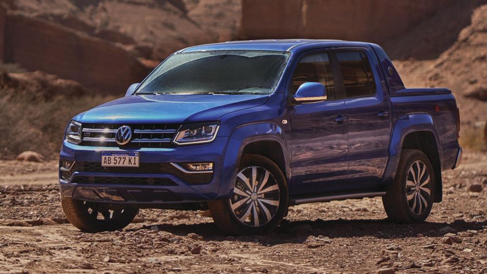 Blue Volkswagen Amarok Pickup Truck in Rugged Desert Landscape wallpaper