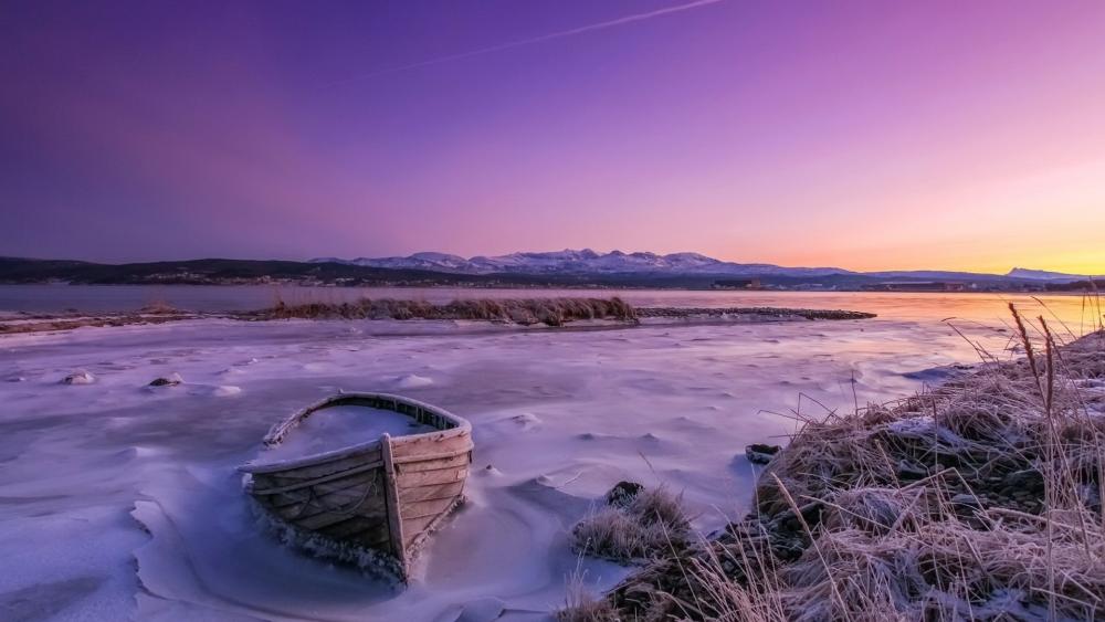 Silent Winter Boat on a Frozen Lake Under Purple Skies wallpaper