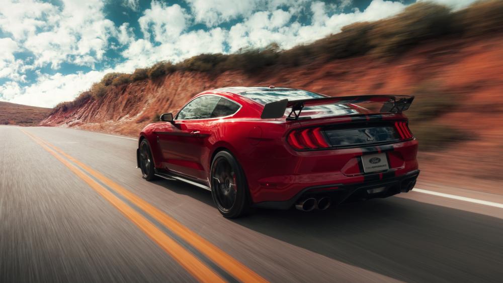 Red Shelby GT500 Mustang Racing the Open Highway in 4K wallpaper