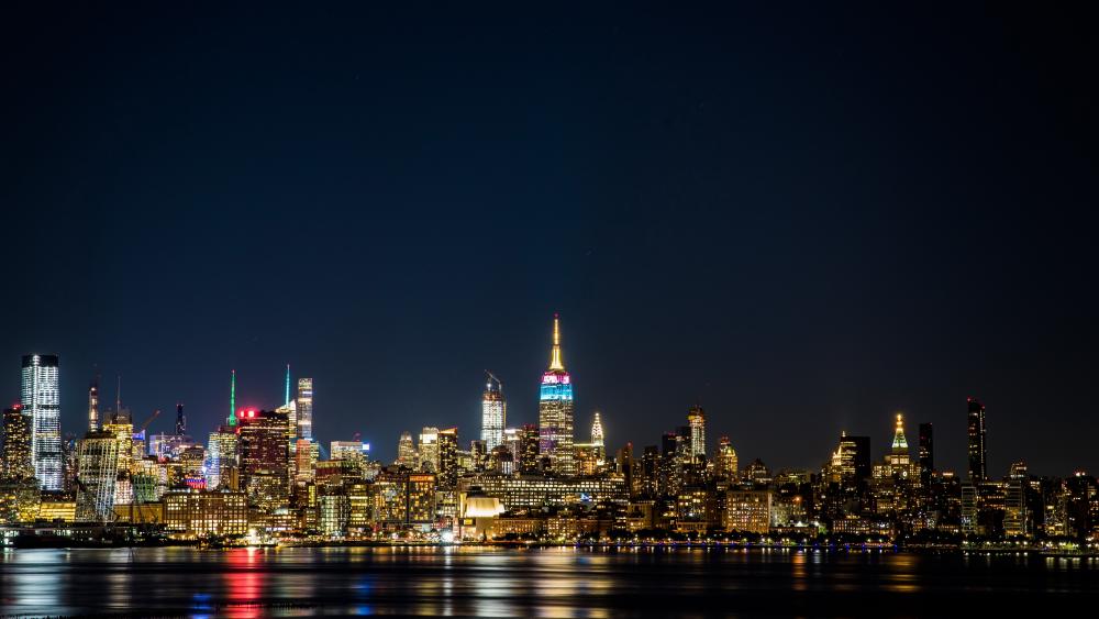 Midtown Manhattan Night Skyline Reflecting on the Hudson River wallpaper