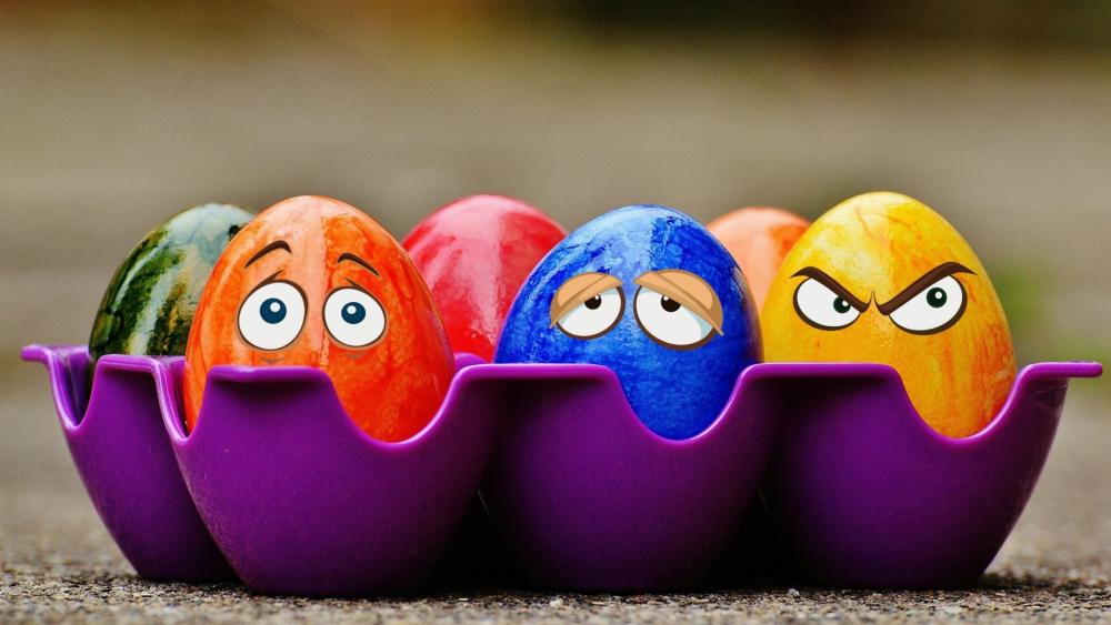 Goofy Easter Eggs Pulling Faces in a Purple Carton wallpaper