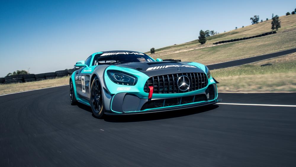 Mercedes AMG GT4 Charging Through a Sunlit Track Curve wallpaper