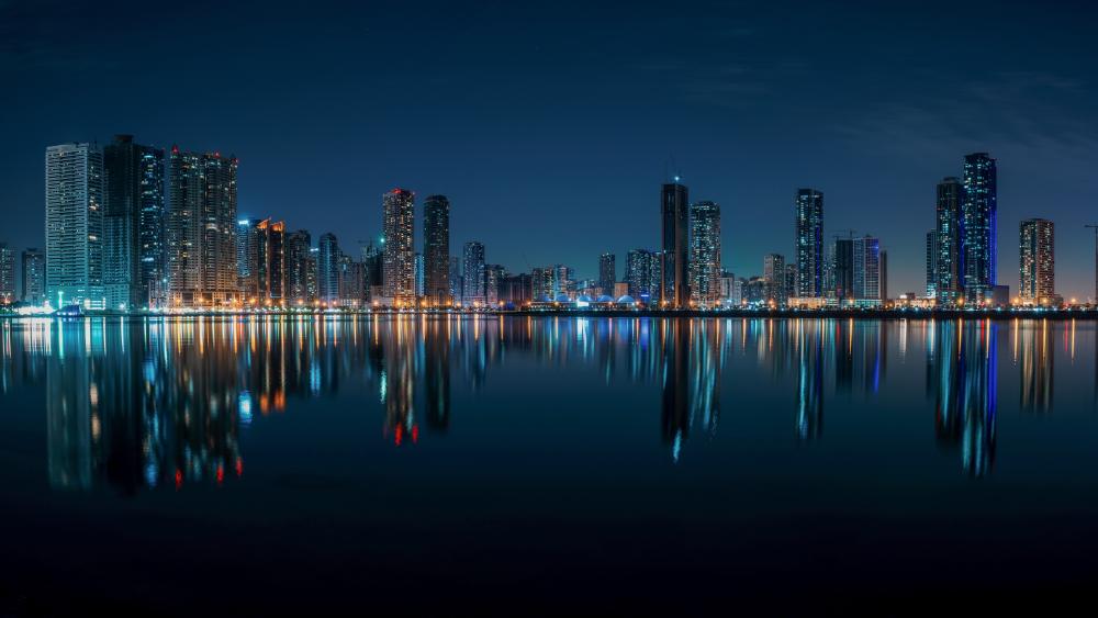 Sharjah Night Skyline Reflections Over Still Waters in the UAE wallpaper