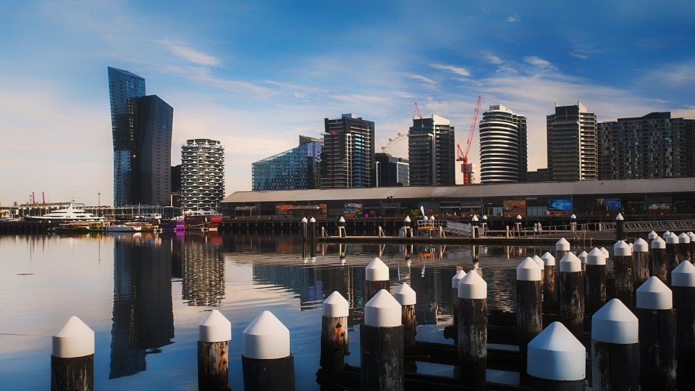 Docklands Melbourne Skyline Reflections Over a Calm Harbor wallpaper