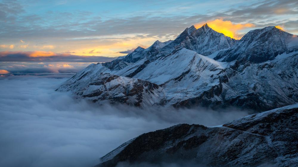 Sunrise Above the Sea of Clouds in the Swiss Alps wallpaper