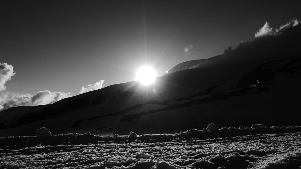 Majestic Winter Sunrise Over Snowy Slopes wallpaper