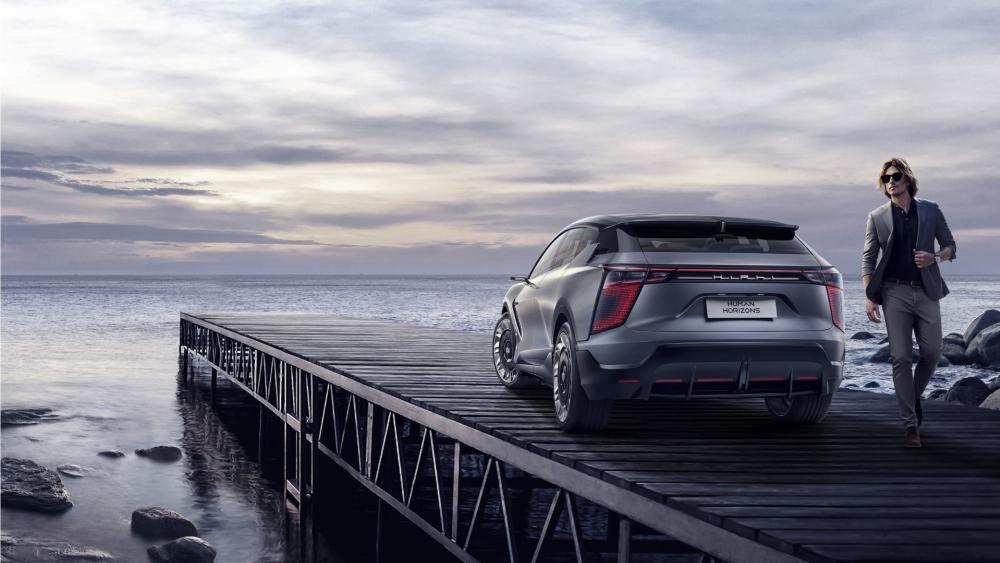 HiPhi X SUV on Coastal Pier in Moody Twilight wallpaper