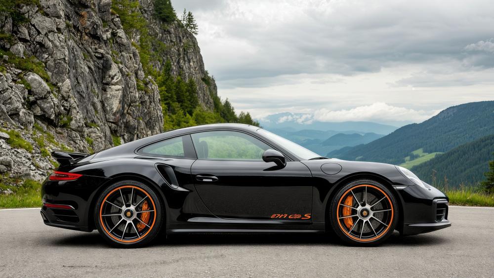 Black Porsche 911 Turbo S on Alpine Mountain Road 4K Wallpaper wallpaper