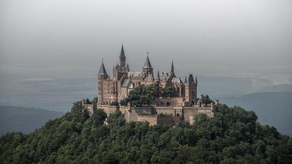 Hohenzollern Castle Rising Above Forested Hills in Baden Württemberg wallpaper