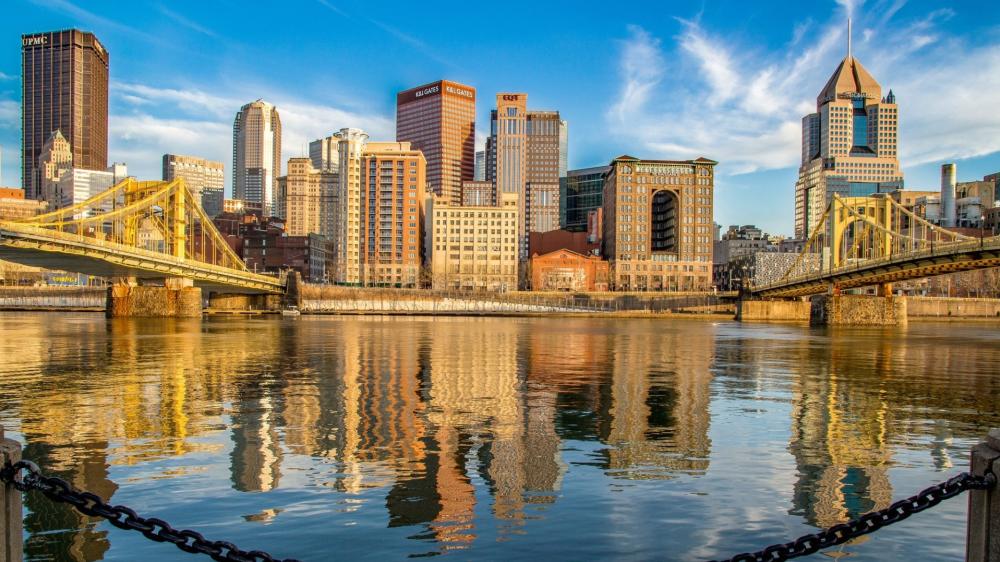 Golden Reflections Over Pittsburgh Skyline and Bridges wallpaper