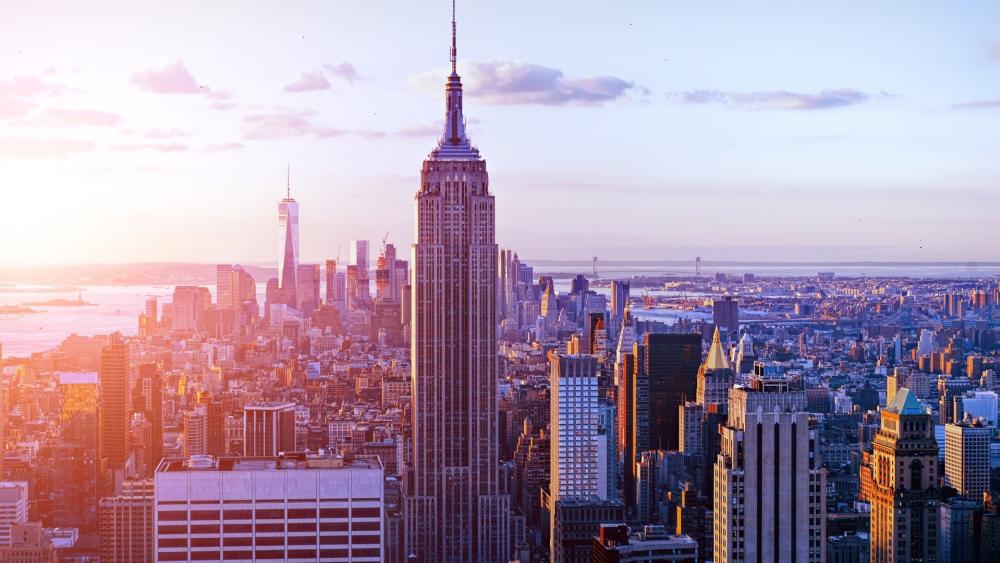 Sunlit New York City Skyline with Iconic Empire State Tower View wallpaper