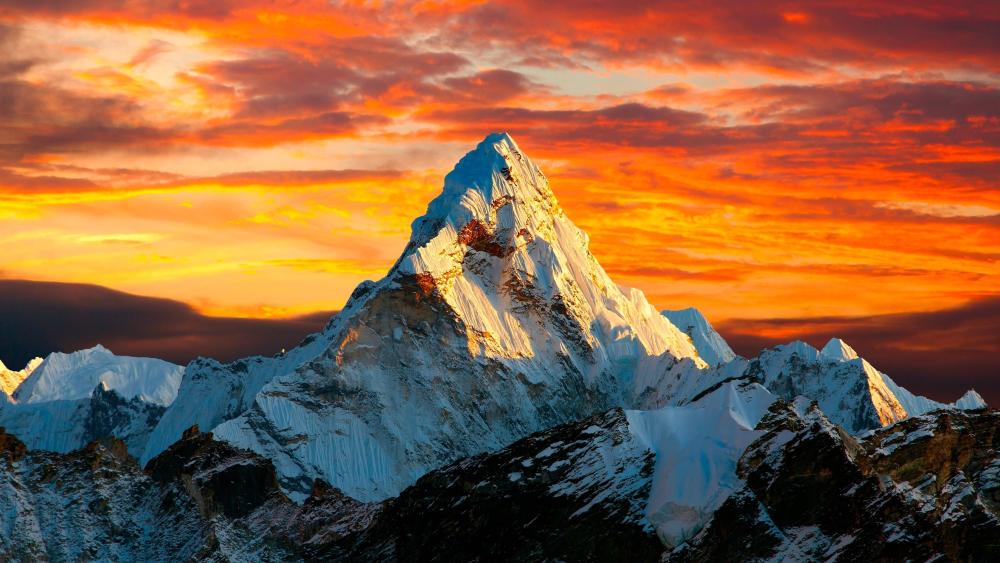 Blazing Golden Hour Over a Snowcapped Alpine Summit wallpaper