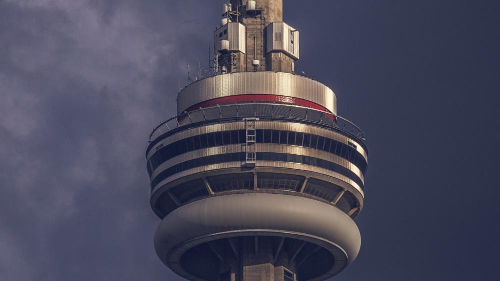Close Up Majesty of Toronto CN Tower Against Moody Sky wallpaper