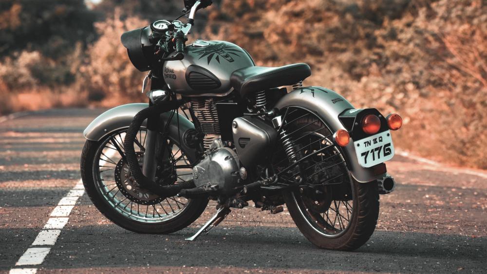 Royal Enfield Classic Motorcycle Waiting on a Quiet Road wallpaper