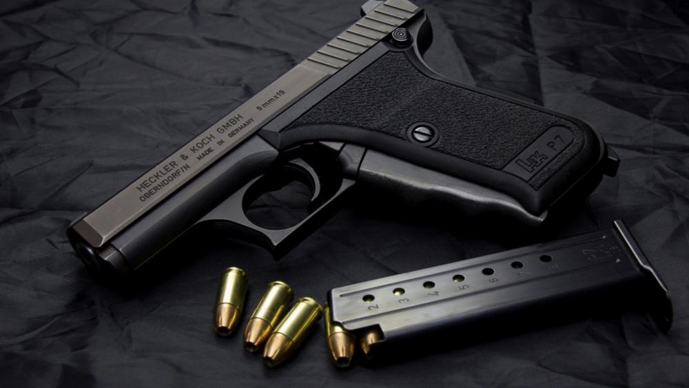 Heckler and Koch P7 Pistol with Magazine and Brass Rounds wallpaper
