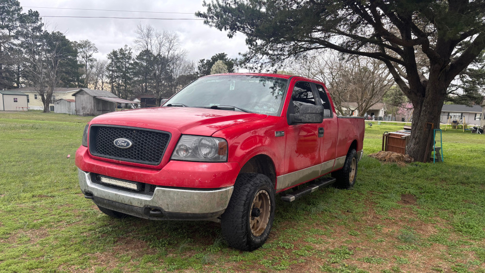 Red Ford Pickup in Rustic Yard wallpaper
