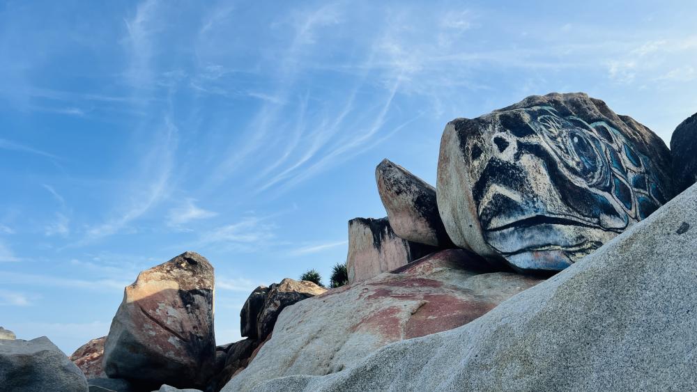 Weathered Boulders Under Open Blue Sky wallpaper