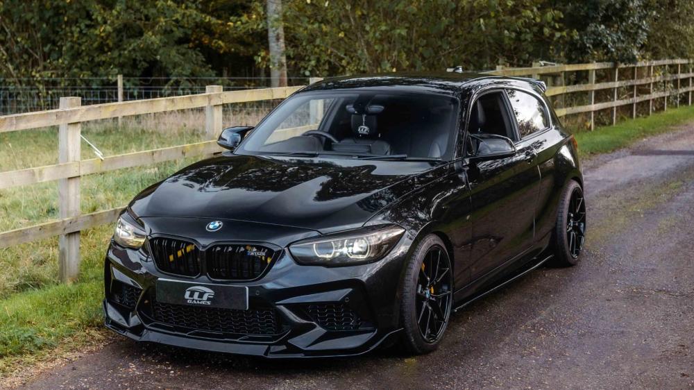 Black BMW M140i on Country Road wallpaper