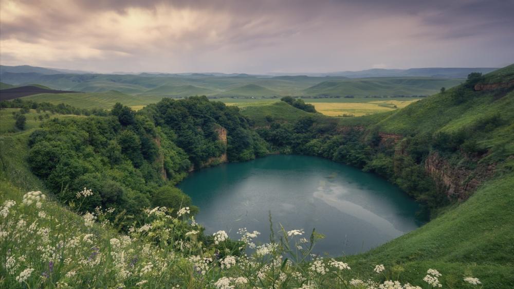 Hidden Karst Lake in Shadkhurey Hills wallpaper