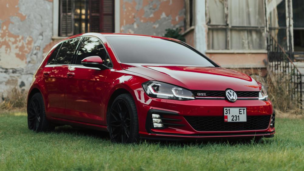 Red Volkswagen GTI in Urban Retro Setting wallpaper