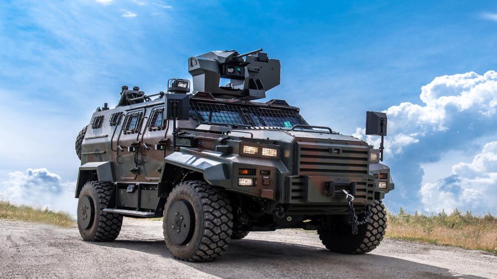 Armored Tactical Vehicle Under Open Sky wallpaper