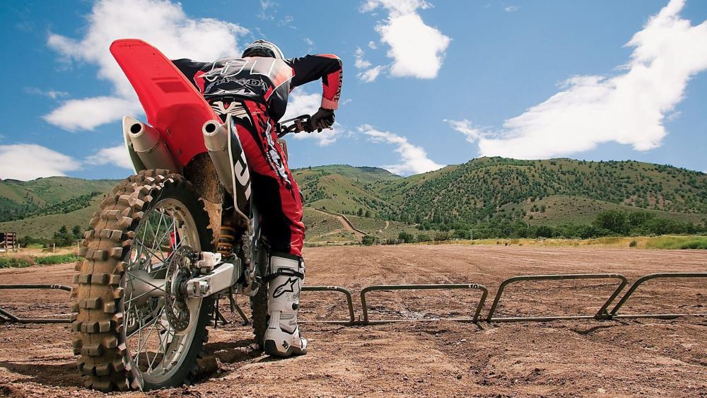 Motocross Rider Ready for Off Road Action wallpaper