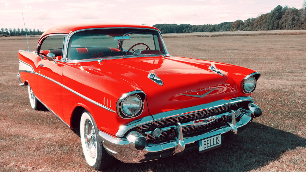 Classic Red Chevrolet Bel Air on Open Field wallpaper