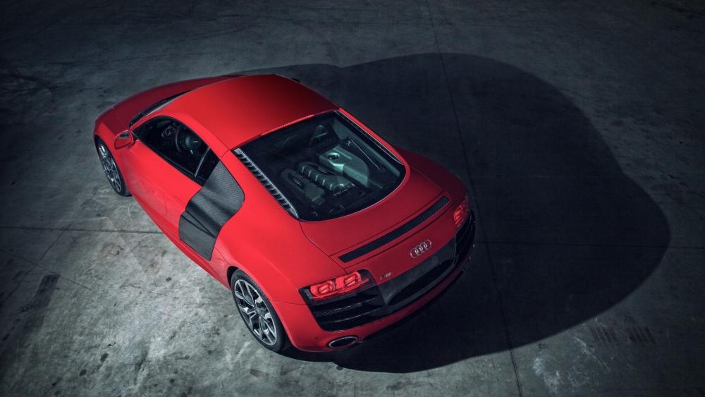 Red Audi Supercar Under Dramatic Light wallpaper