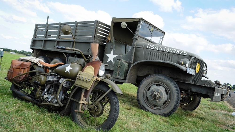 WWII Military Motorcycle and Army Truck Display wallpaper