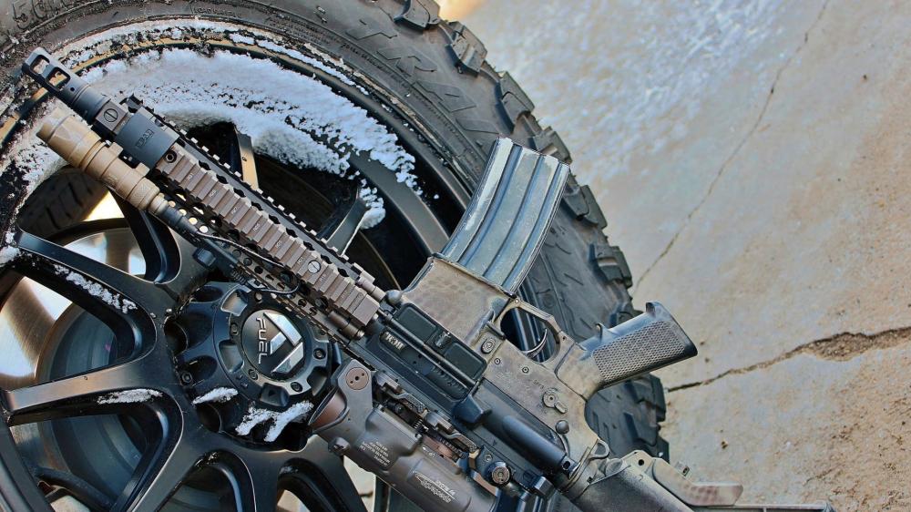 Gray Tactical Rifle on Winter Wheel wallpaper