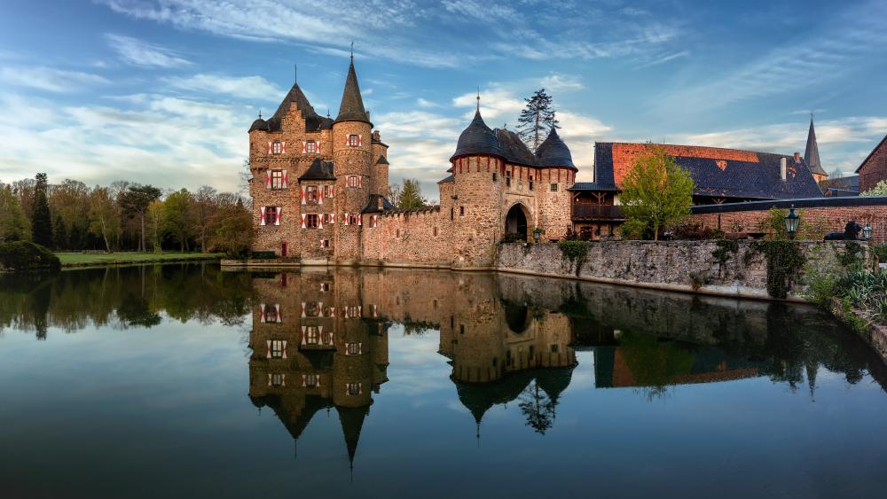 Castle Satzvey Reflected in Calm Eifel Waters wallpaper