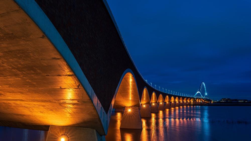 Illuminated Bridge Over the River at Night wallpaper