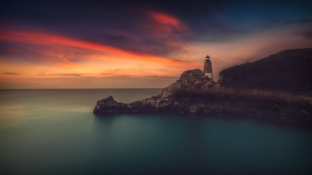 Twilight Lighthouse Over Calm Horizon wallpaper