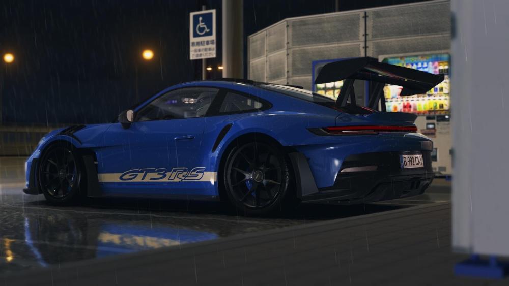 Dynamic Porsche 911 GT3 RS in Rainy Night Setting wallpaper